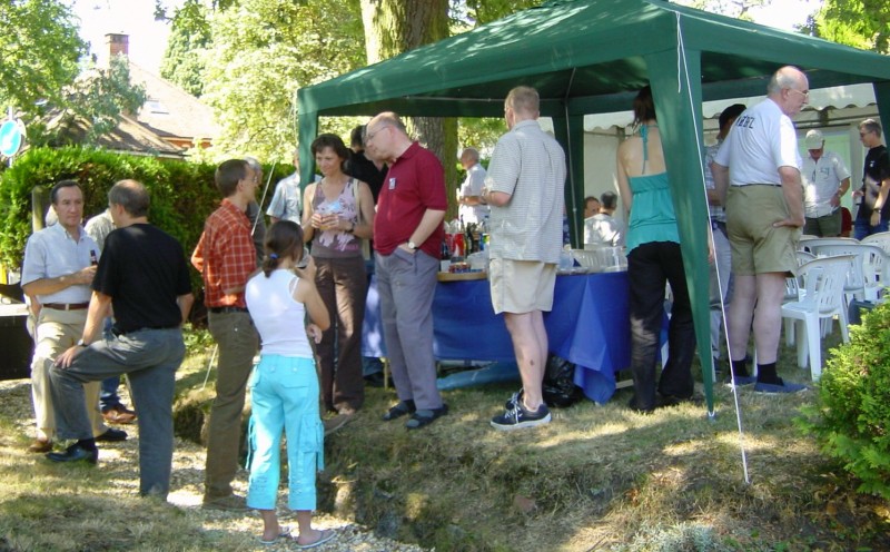 ../Images/Jack-LX1JX talking with Clive-G4FVP next to the beer tent (the small girl is Jack's daughter).jpg